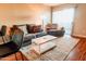 Comfortable living room with plush seating, decorative rug, and abundant natural light at 1645 W Baseline Rd # 2026, Mesa, AZ 85202