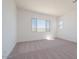 Large bedroom with plush carpet and ample natural light creating a cozy space at 1892 E Empeltre Rd, San Tan Valley, AZ 85140