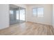 Bedroom with wood tile flooring, natural light, and backyard access via sliding glass door at 1892 E Empeltre Rd, San Tan Valley, AZ 85140
