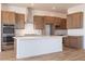 Well-equipped kitchen with modern cabinetry, stainless steel appliances, and a spacious center island at 1892 E Empeltre Rd, San Tan Valley, AZ 85140
