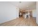 Bright and airy living room showcasing wood tile flooring and recessed lighting at 1892 E Empeltre Rd, San Tan Valley, AZ 85140