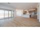 Open-concept living space showcasing wood tile flooring and natural light at 1892 E Empeltre Rd, San Tan Valley, AZ 85140