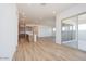Open concept living space adjacent to a kitchen and access to the outdoor space at 1892 E Empeltre Rd, San Tan Valley, AZ 85140