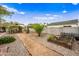 Well-maintained backyard with gravel paths, garden beds, and lush foliage at 1910 W Holly St, Phoenix, AZ 85009