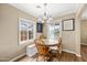 Bright breakfast nook with wood table set and windows providing natural light at 1910 W Holly St, Phoenix, AZ 85009