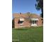 Charming brick home with well-maintained lawn at 1910 W Holly St, Phoenix, AZ 85009