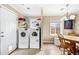 Bright laundry area features modern washer, dryer, and a convenient dining area at 1910 W Holly St, Phoenix, AZ 85009