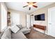 Cozy living room with large grey couch and TV at 1910 W Holly St, Phoenix, AZ 85009