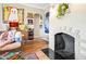 Cozy living room with decorative fireplace, art and vintage stereo system at 1910 W Holly St, Phoenix, AZ 85009