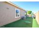 Beautiful backyard with artificial turf and a small putting green at 19672 N 260Th Ave, Buckeye, AZ 85396