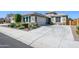 Charming single-story home with desert landscaping and a spacious concrete driveway at 19672 N 260Th Ave, Buckeye, AZ 85396