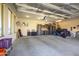 Spacious garage with ample storage and a motorcycle at 19672 N 260Th Ave, Buckeye, AZ 85396