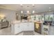 Open concept kitchen with island, granite countertops and stainless steel appliances at 19672 N 260Th Ave, Buckeye, AZ 85396