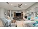 Spacious living room with neutral tones, ample seating, and a large entertainment center at 19672 N 260Th Ave, Buckeye, AZ 85396