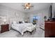 Serene bedroom featuring a decorative wall, plush bed, and elegant furnishings at 19672 N 260Th Ave, Buckeye, AZ 85396