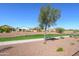 Neighborhood walking path in a landscaped common area at 19672 N 260Th Ave, Buckeye, AZ 85396
