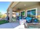 Covered patio with comfortable seating, ideal for enjoying the outdoor space and backyard views at 19672 N 260Th Ave, Buckeye, AZ 85396