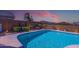 Sparkling pool with colorful landscaping and decorative wall art at 19672 N 260Th Ave, Buckeye, AZ 85396