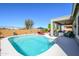 Spacious backyard features a refreshing pool and a covered patio, perfect for outdoor entertaining and relaxation at 19672 N 260Th Ave, Buckeye, AZ 85396