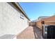 Gravel side yard with AC unit and view of neighboring homes at 19672 N 260Th Ave, Buckeye, AZ 85396