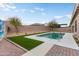 Beautiful backyard featuring a sparkling pool, lush artificial grass, and desert landscaping for low maintenance appeal at 23800 N 169Th Ave, Surprise, AZ 85387