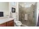 Modern bathroom featuring a tiled walk-in shower, updated fixtures, and a sleek vanity with ample counter space at 23800 N 169Th Ave, Surprise, AZ 85387