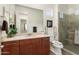 Modern bathroom featuring vanity with stone countertop, frameless shower, and neutral decor at 23800 N 169Th Ave, Surprise, AZ 85387