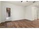 Bright bedroom featuring wood-look flooring and access to the backyard at 23800 N 169Th Ave, Surprise, AZ 85387