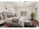 This primary bedroom offers natural light and contemporary decor to create a cozy and inviting atmosphere at 23800 N 169Th Ave, Surprise, AZ 85387