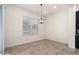Bright dining area featuring modern light fixtures and ample natural light at 23800 N 169Th Ave, Surprise, AZ 85387