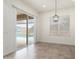 Cozy dining area with a sliding glass door to the backyard at 23800 N 169Th Ave, Surprise, AZ 85387