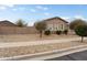 Charming single-story home boasts attractive curb appeal with desert landscaping and mature trees at 23800 N 169Th Ave, Surprise, AZ 85387