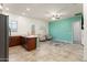 Well-designed kitchen adjacent to a spacious living area, showcasing modern appliances, stylish countertops, and flooring at 23800 N 169Th Ave, Surprise, AZ 85387