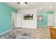 Stylish living room with ample space, a mounted TV, recessed lighting, and access to other areas of the home at 23800 N 169Th Ave, Surprise, AZ 85387