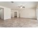 Open living room with neutral color palette and access to other rooms at 23800 N 169Th Ave, Surprise, AZ 85387