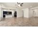 Spacious living room and kitchen combo with tiled floor and ample natural light creating a welcoming atmosphere at 23800 N 169Th Ave, Surprise, AZ 85387