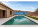 Backyard pool with a painted mural, artificial turf, and a patio area for entertaining at 23800 N 169Th Ave, Surprise, AZ 85387