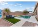 A backyard showcasing a pool area with modern patio furniture and landscaping, perfect for relaxation at 23800 N 169Th Ave, Surprise, AZ 85387
