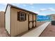 A charming storage shed with matching colors and functional style at 23800 N 169Th Ave, Surprise, AZ 85387