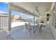 Inviting covered patio with a ceiling fan and ample seating, perfect for outdoor dining and relaxation at 25038 W Rancho Vista Dr, Buckeye, AZ 85326