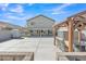 Large backyard featuring a gazebo, covered patio with grill, and plenty of space for outdoor activities at 25038 W Rancho Vista Dr, Buckeye, AZ 85326