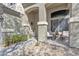 Inviting front porch with a seating area, decorative plants, and a welcoming ambiance at 25038 W Rancho Vista Dr, Buckeye, AZ 85326