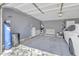 Spacious garage with epoxy flooring, ample storage, and a modern water filtration system at 25038 W Rancho Vista Dr, Buckeye, AZ 85326