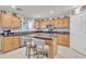 Spacious kitchen featuring an island with seating, stainless steel appliances, and ample cabinet space at 25038 W Rancho Vista Dr, Buckeye, AZ 85326