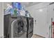 Convenient laundry room with modern washer and dryer, ample storage, and organization at 25038 W Rancho Vista Dr, Buckeye, AZ 85326
