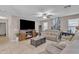 Comfortable living room features a fireplace, ceiling fan, and neutral-toned walls at 25038 W Rancho Vista Dr, Buckeye, AZ 85326