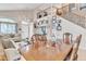 Elegant dining area and Gathering room with an open staircase, decorative furnishings, and natural light at 25038 W Rancho Vista Dr, Buckeye, AZ 85326