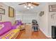 Relaxing living room with hardwood floors, comfortable seating, and sports memorabilia decor at 25038 W Rancho Vista Dr, Buckeye, AZ 85326