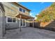 The backyard features a covered patio, concrete paving, and access to the home through French doors at 2604 W Wolf St, Phoenix, AZ 85017