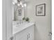 Stylish bathroom vanity boasting a marble countertop, sleek fixtures, and decorative accents at 2604 W Wolf St, Phoenix, AZ 85017